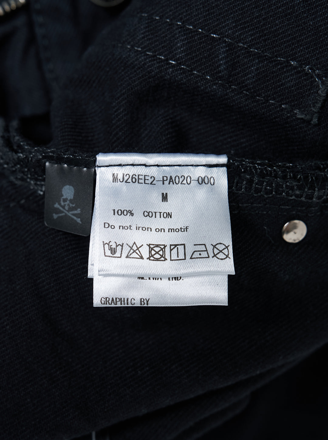 Mastermind wide easy denim pants in washed black with a pink skull and crossbones graphic, drawcord waist and metal D-ring details - view 3