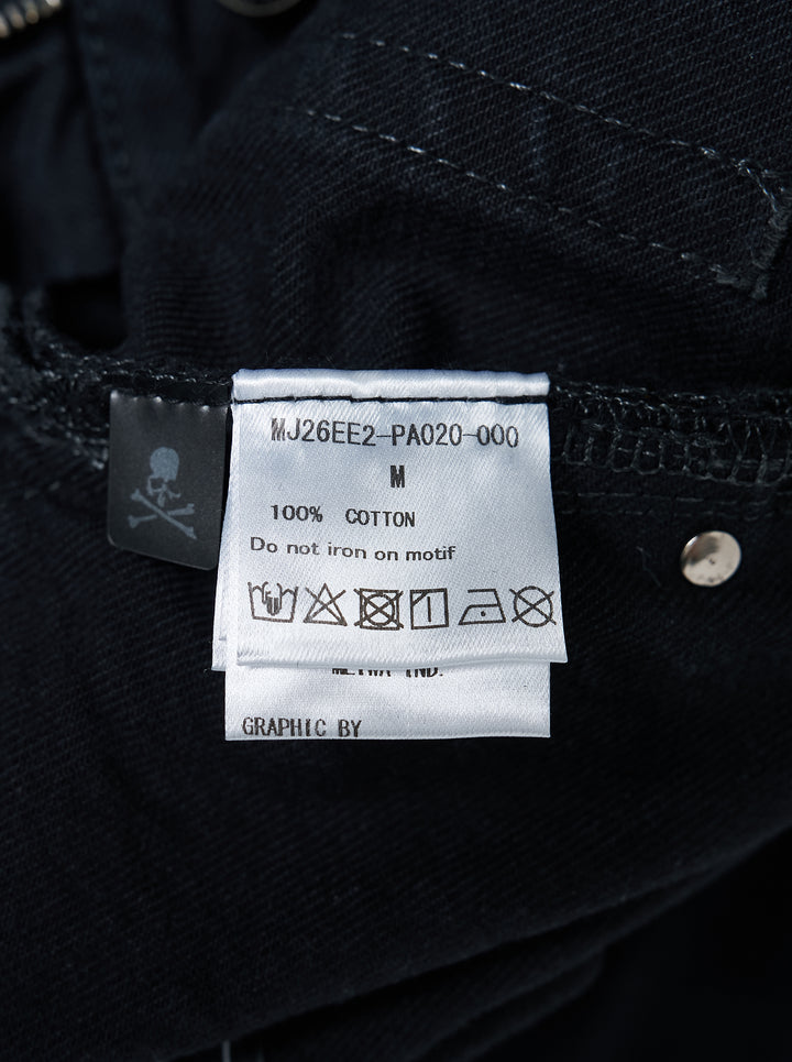 Mastermind wide easy denim pants in washed black with a pink skull and crossbones graphic, drawcord waist and metal D-ring details - view 3
