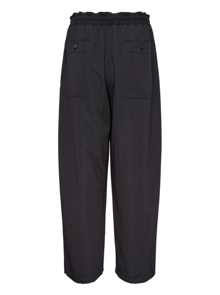 Lemaire black wool gabardine jogger pants with an elasticated waist and relaxed wide-leg silhouette, shown from the front - view 2