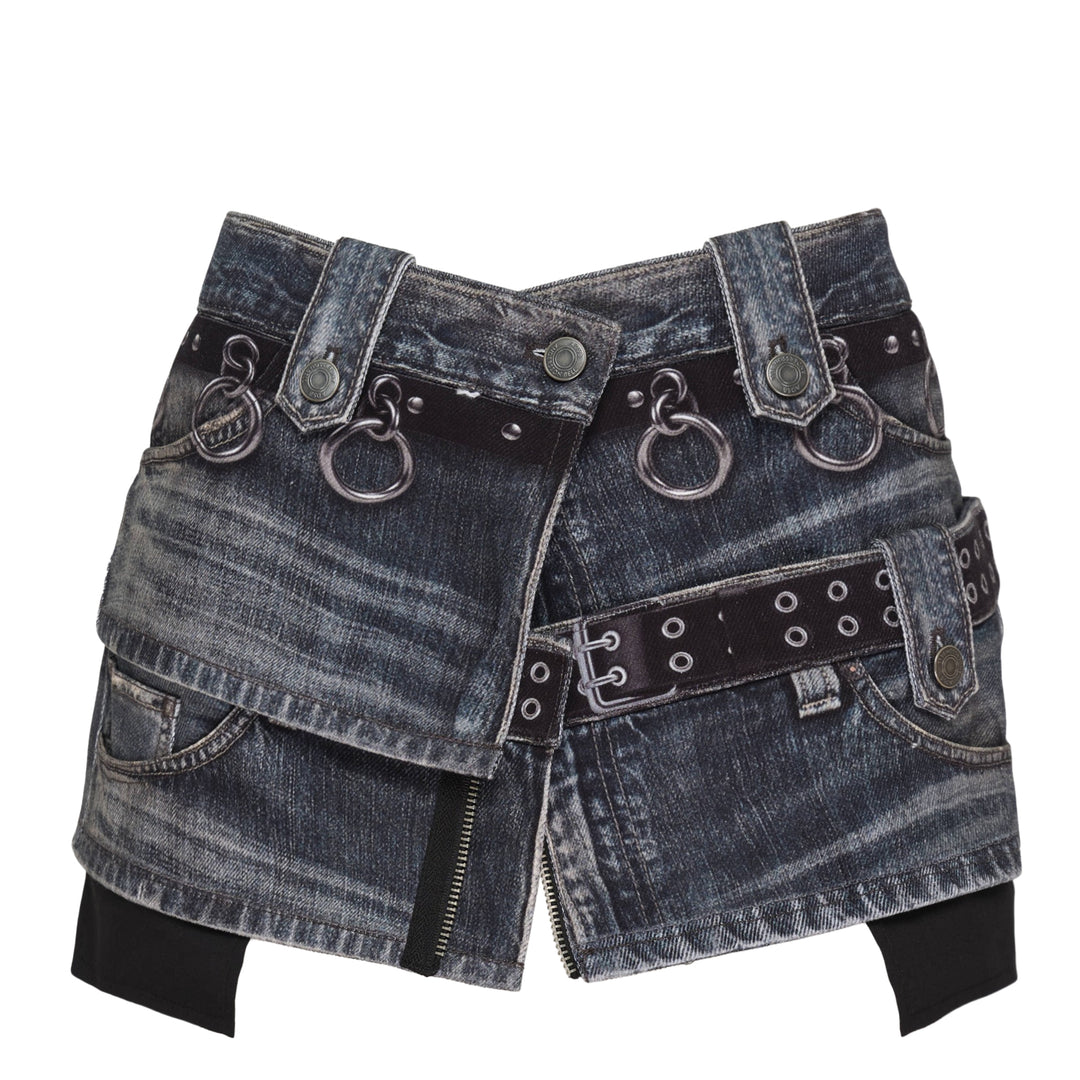 Andersson Bell Asymmetric Layered Wrap Skirt in washed indigo denim with studded belt straps, silver O-ring hardware, exposed zip, and contrast black layered hem