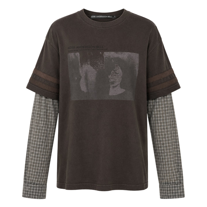 Andersson Bell Layered Sleeve Graphic Tee in washed dark jersey with tonal chest graphic print and green plaid shirting underlayer sleeves, shot flat on white background