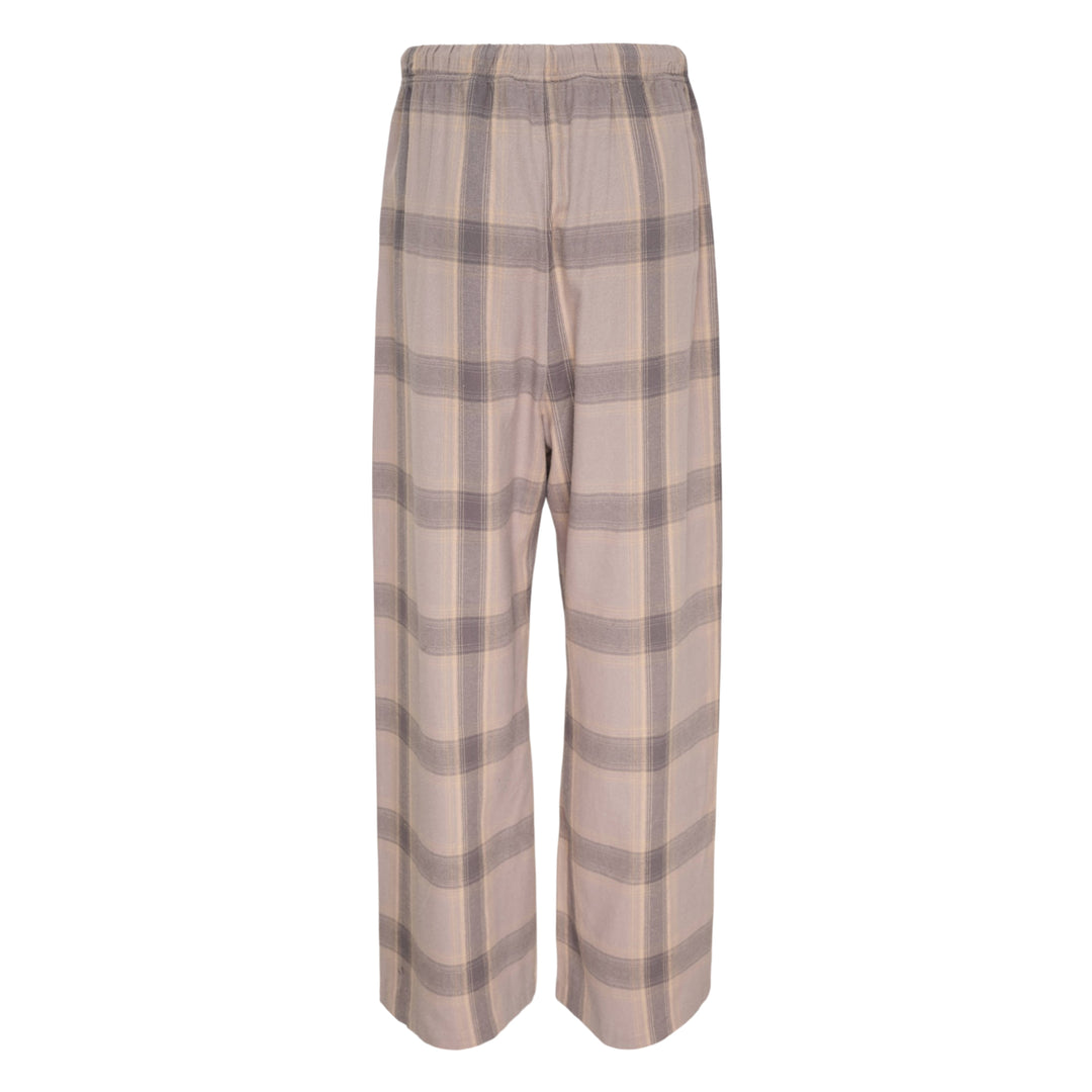 Fear of God Essentials Plaid Lounge Pants in black and cream windowpane check with wide-leg silhouette and elasticated drawstring waistband, flat lay on white background