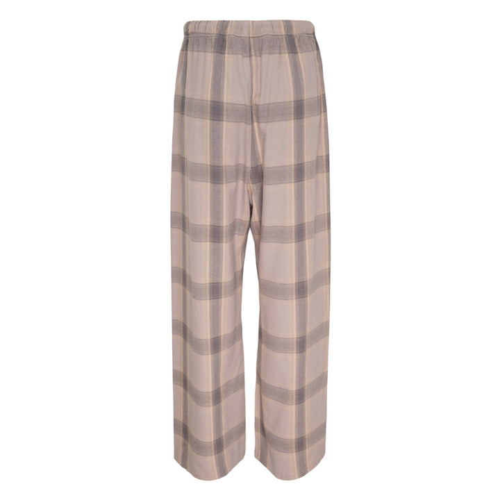 Fear of God Essentials Plaid Lounge Pants in black and cream windowpane check with wide-leg silhouette and elasticated drawstring waistband, flat lay on white background