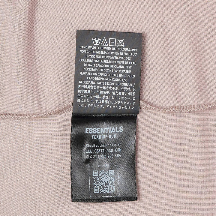 Fear of God Essentials Soft Rib Fitted Tank in taupe, featuring a crew neckline, cap-shoulder sleeveless silhouette, and woven brand label at the back neck