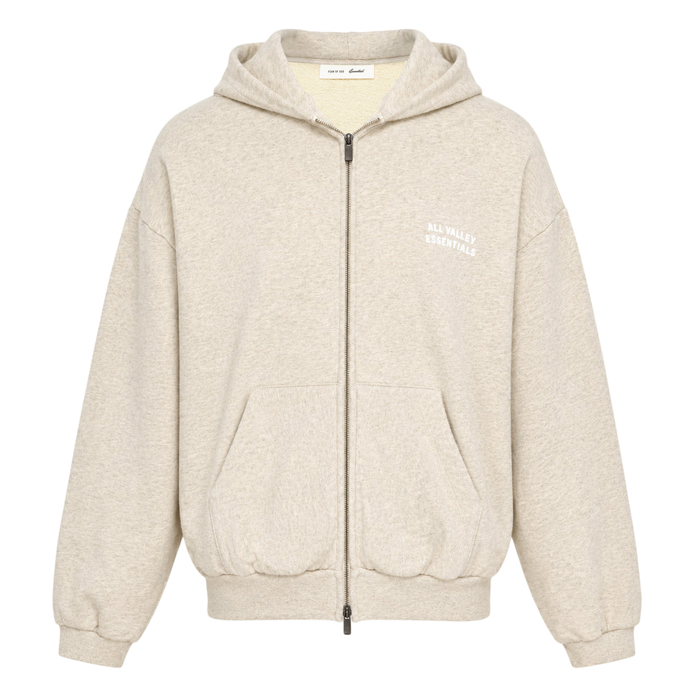 Fear of God Essentials 90s Zip-Up Hoodie in heather grey marl, displayed flat with zip open, featuring an embroidered All Valley Essentials chest graphic, kangaroo pocket, and ribbed cuffs