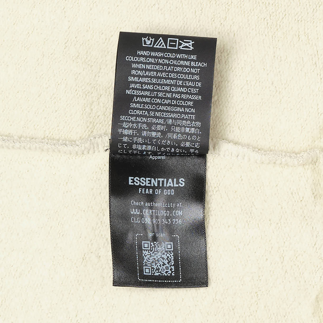 Fear of God Essentials 90s Zip-Up Hoodie in heather grey marl, displayed flat with zip open, featuring an embroidered All Valley Essentials chest graphic, kangaroo pocket, and ribbed cuffs