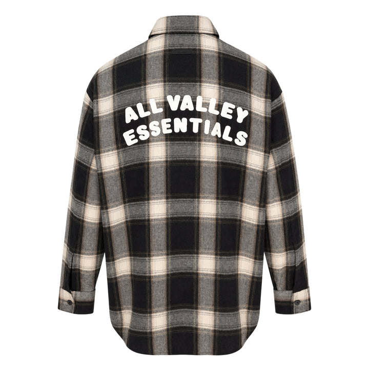 Fear of God Essentials long sleeve plaid button-up shirt in dark navy and grey windowpane check, relaxed oversized fit with concealed placket and tonal buttons, flat lay on white background