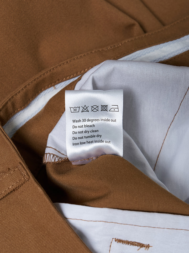 House of Errors pleated wide-leg trousers in camel brown, shown front-on with double front pleats and a high-rise waist - view 4