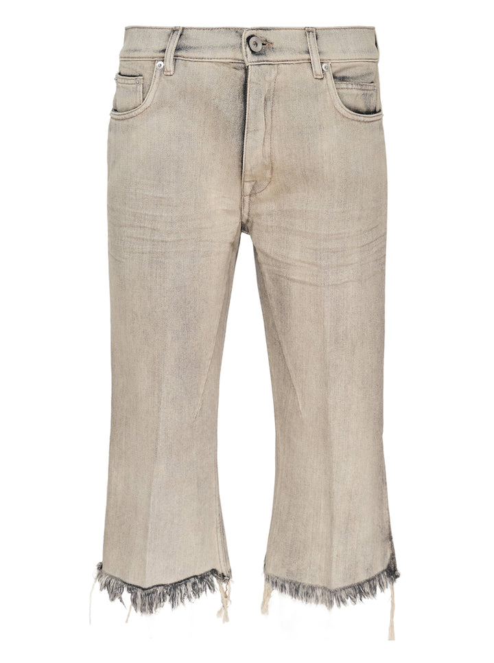 Rick Owens Bolan Cut cropped flare jeans in washed grey denim with heavily frayed raw hem and five-pocket construction, front view