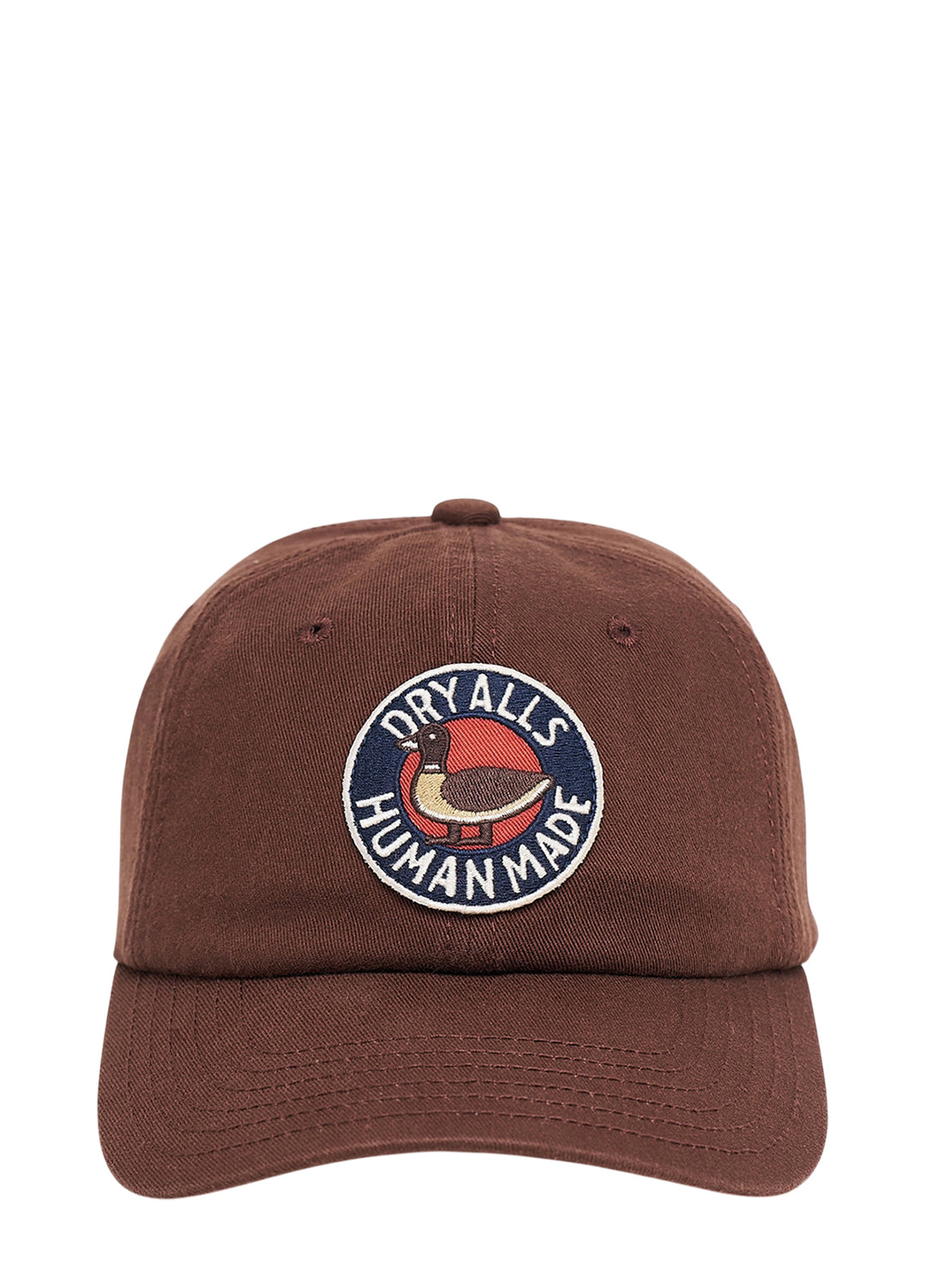 Human Made brown 6-panel twill cap with embroidered circular duck patch reading Dry Alls Human Made