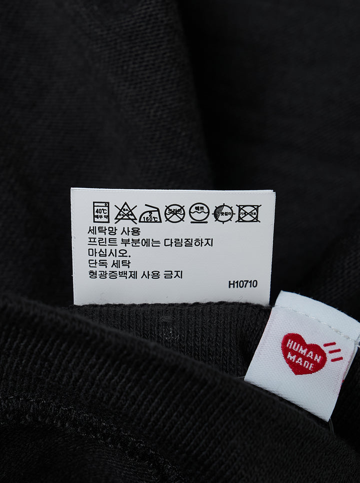 Human Made black short sleeve crew neck tee with smiling pig mascot graphic and arched 'Human Made Dry Alls' slogan print on the chest - view 4