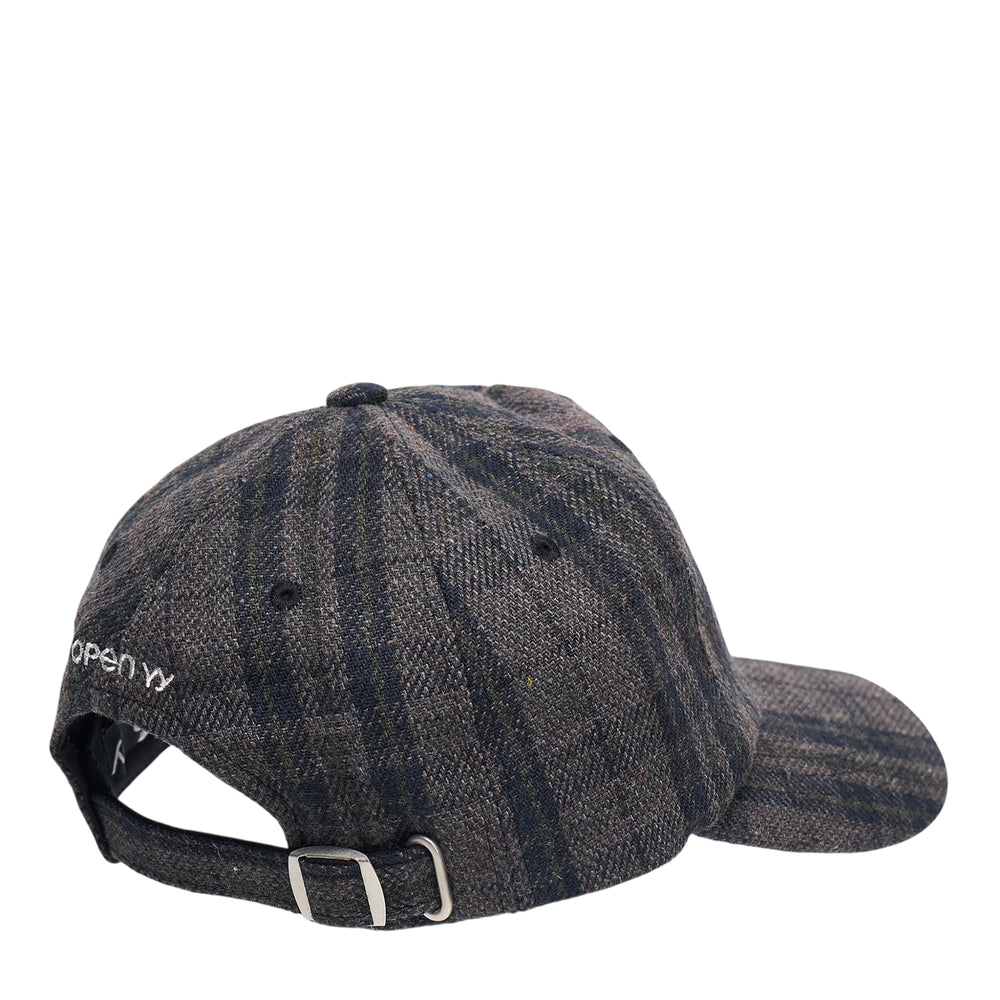 Open YY grey and navy plaid six-panel baseball cap with oversized white puff-embroidered YY bone lettering on the front panel, front view - view 2