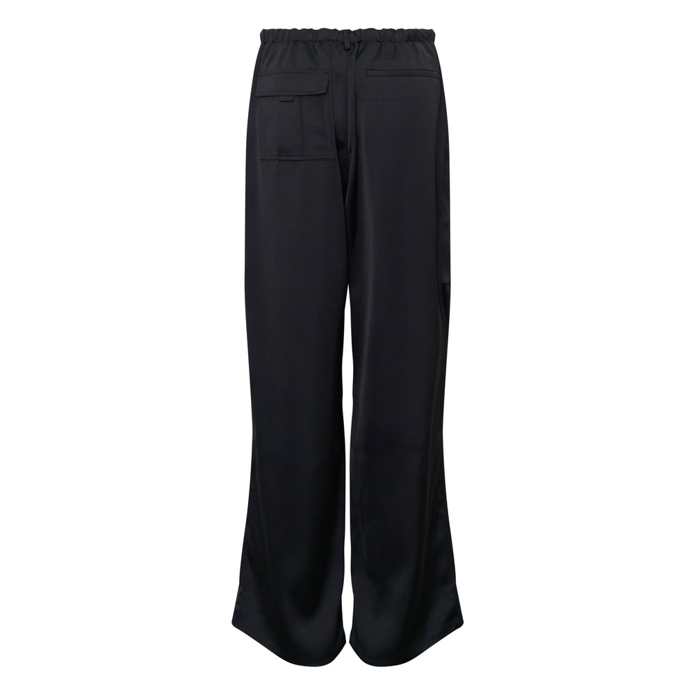 The Loom Atelier Cargo-Lite Trousers in black satin with wide-leg silhouette, drawstring waistband, and patch cargo pocket - view 2