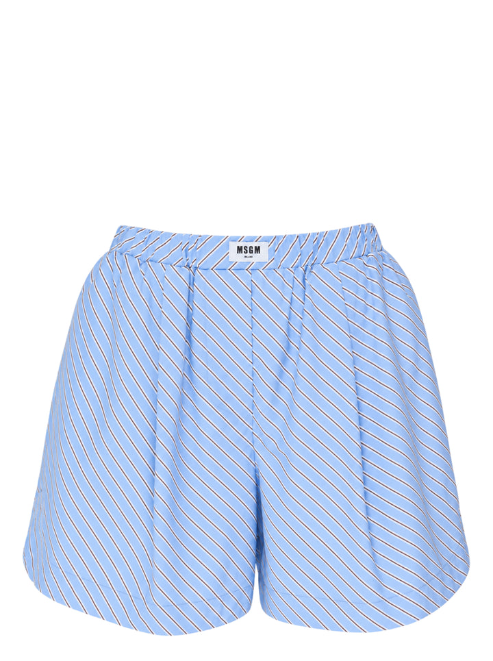 MSGM diagonal stripe shorts in light blue with a flared silhouette, elasticated waistband, and woven MSGM Milano label, front view on white background