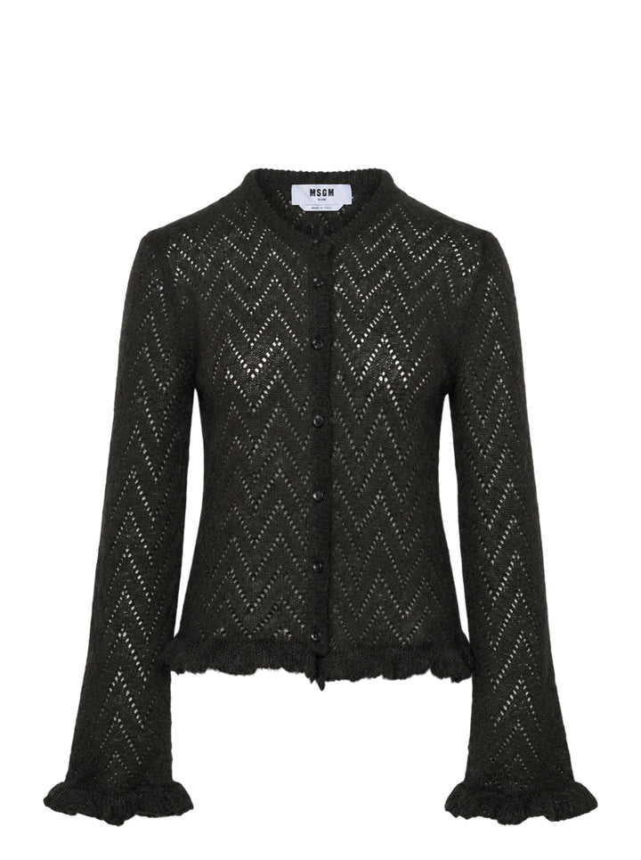MSGM black chevron pointelle knit cardigan with button-front closure, flared bell sleeves with ruffle cuffs, and frayed ruffle hem trim