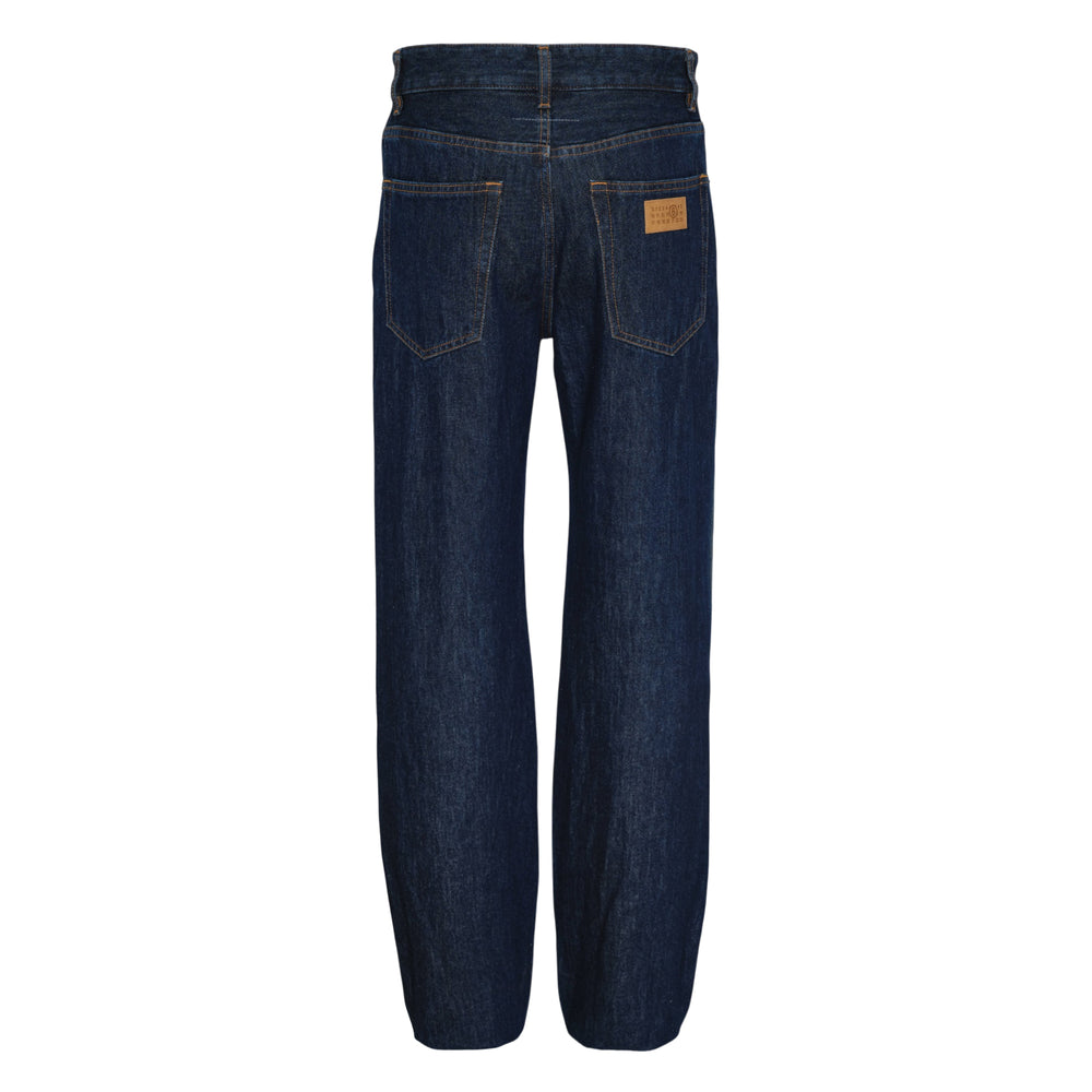 MM6 Maison Margiela distressed two-tone blue denim jeans with frayed knee rips, paint splatter detailing, and a deep indigo contrast lower leg panel