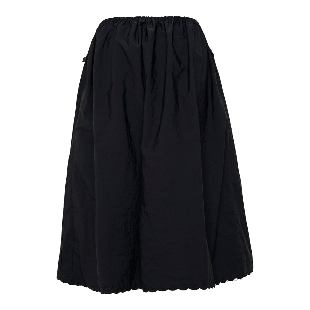 Cecilie Bahnsen Fiella black taffeta midi skirt with elasticated gathered waistband, drawstring tie, and scalloped embroidered hem, displayed flat on a white background