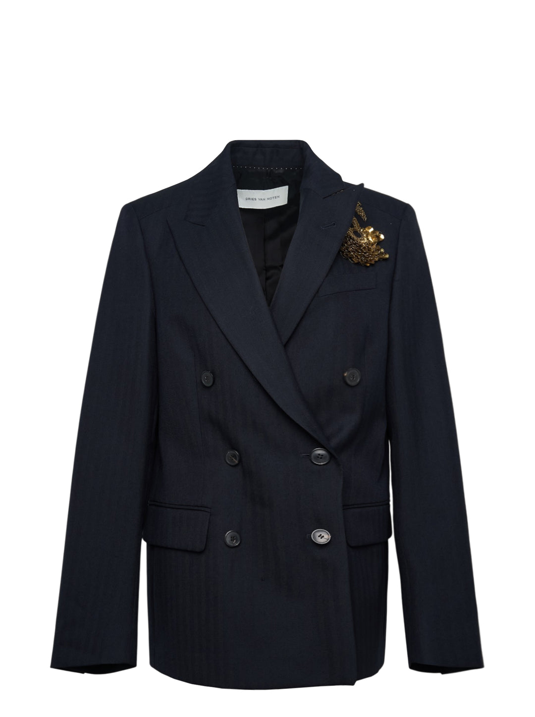 Dries Van Noten navy double-breasted blazer with peak lapels, six dark buttons, hip flap pockets, and an ornate gold embroidered brooch detail on the chest