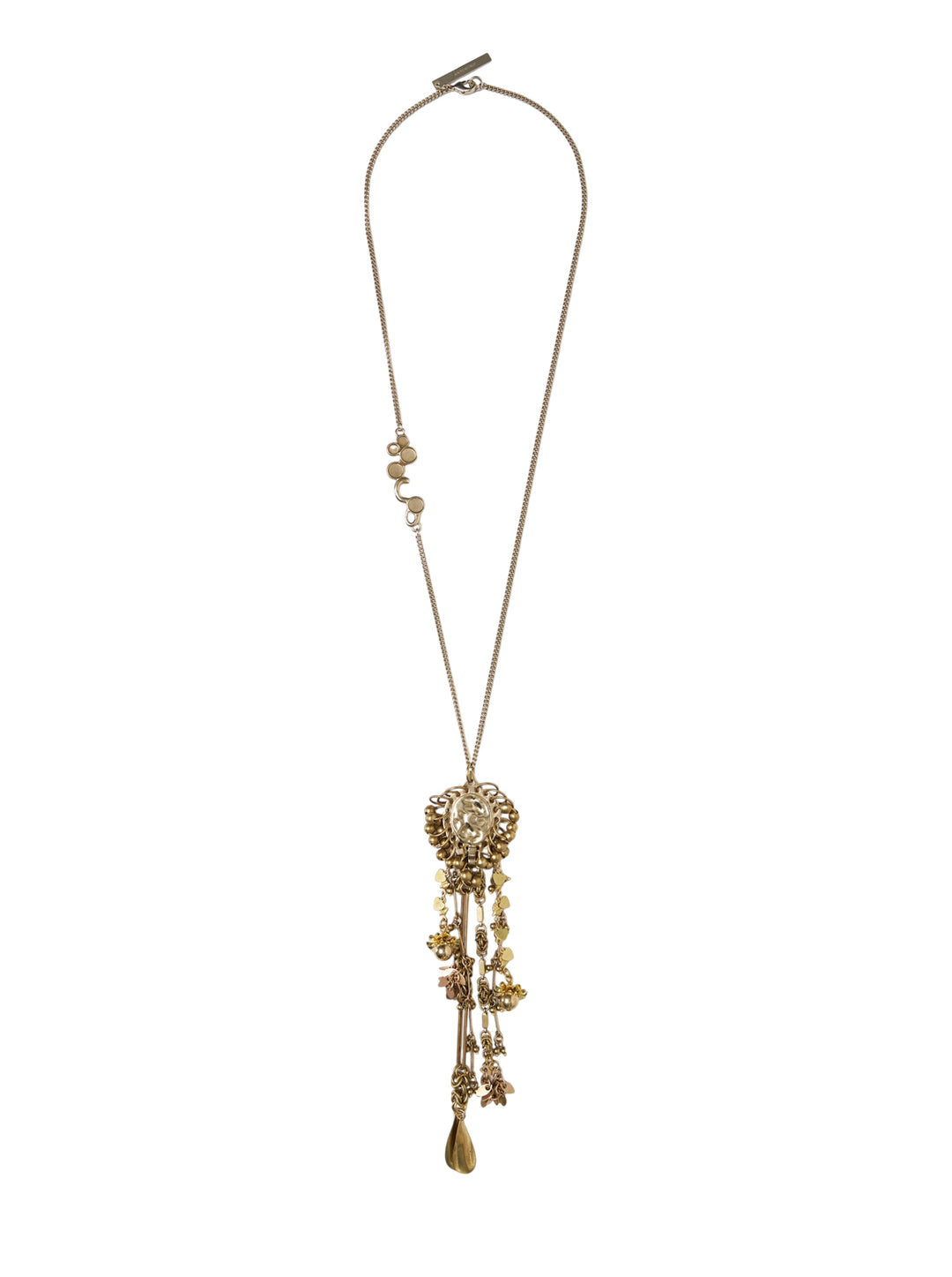 Dries Van Noten handmade gold-tone pendant necklace with ornate floral medallion centrepiece, cascading mixed charms, and long curb chain on white background