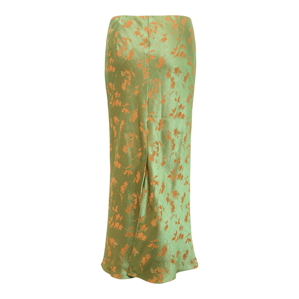 Dries Van Noten sage green floral jacquard midi bias skirt with orange flower motifs and a flared hem, shown flat against a white background