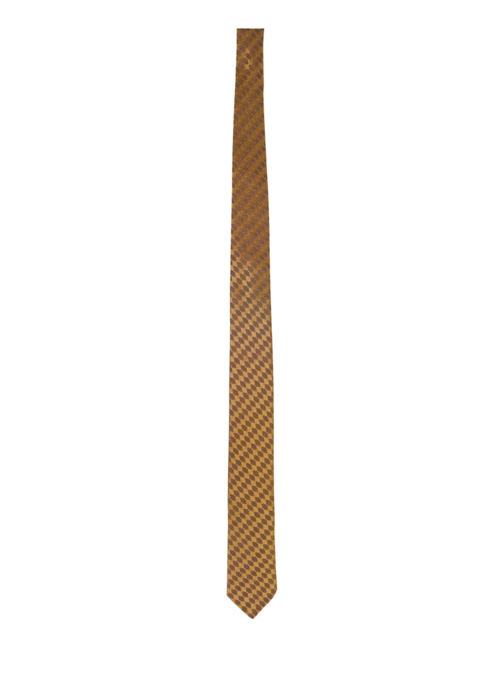 Dries Van Noten diamond check silk tie in amber and brown harlequin jacquard, shown knotted against a white background - view 2