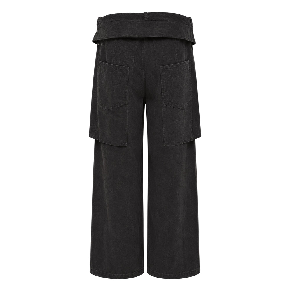 Andersson Bell Raptor Three Layered Wide-Leg Pants in dark charcoal fine-wale corduroy, featuring a folded structural waistband, dual-height flap cargo pockets, and a relaxed wide-leg silhouette