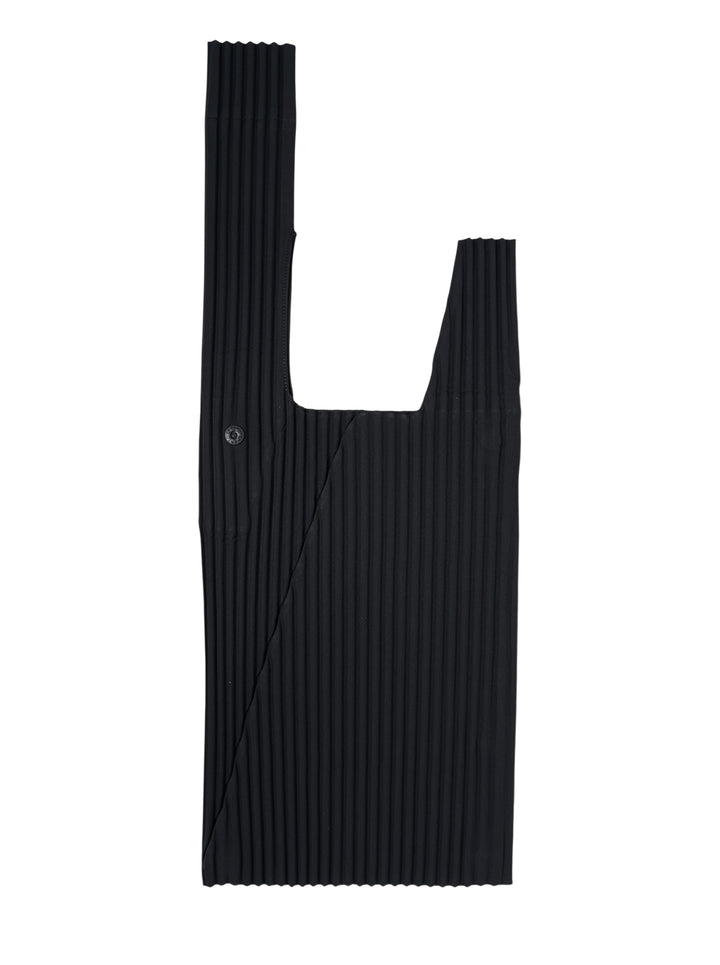 Homme Plissé Issey Miyake Umbrella Pleats Bag in black, featuring fine vertical pleated ribbing, dual handles, and a snap button side closure, laid flat against a white background