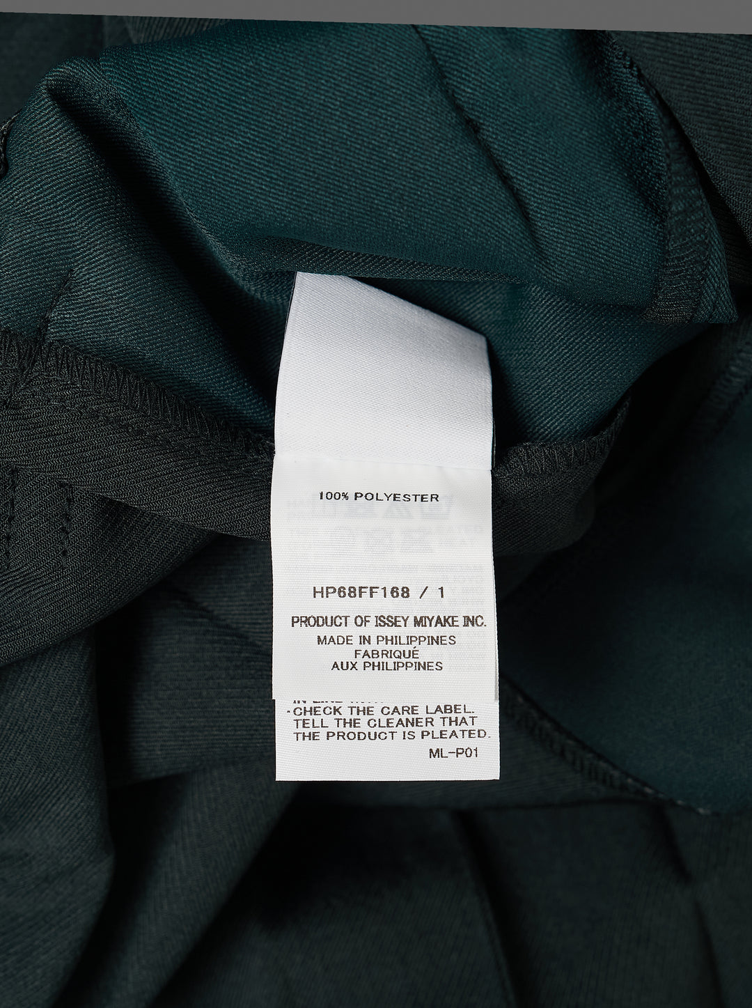 Homme Plissé Issey Miyake Edge Ensemble Pleated Pants in deep teal, featuring wide-leg silhouette with cascading knife pleats and a layered horizontal knee seam, shown flat on white background - view 3
