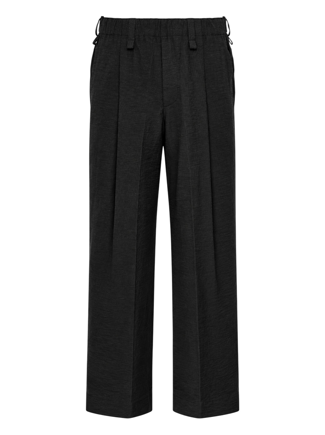 Homme Plissé Issey Miyake Opacity Woven Pants in black, flat lay showing wide-leg silhouette with front creases and elasticated drawstring waistband