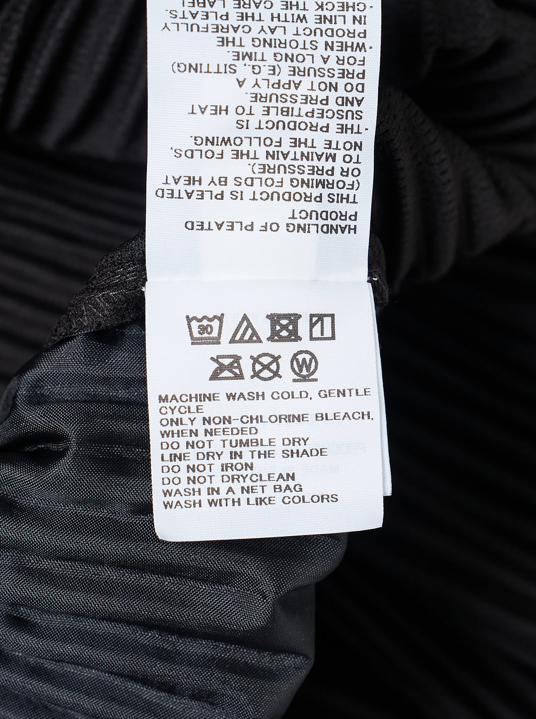 Homme Plissé Issey Miyake Compleat Pleated Trousers in black, shown flat with all-over permanent pleating and elasticated waistband - view 3