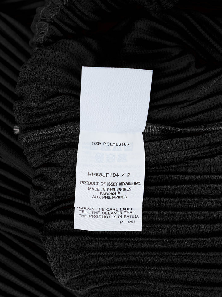 Black long-sleeve pleated button-up shirt by Homme Plissé Issey Miyake from the Monthly Colors October collection, shown from the front - view 3