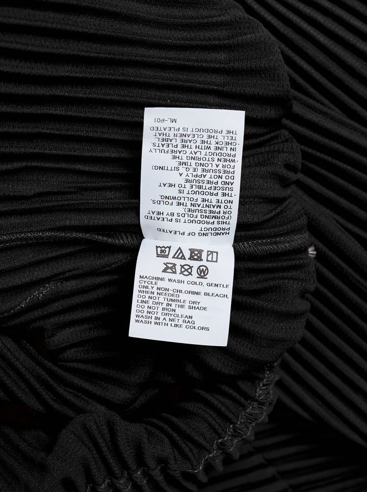 Black long-sleeve pleated button-up shirt by Homme Plissé Issey Miyake from the Monthly Colors October collection, shown from the front - view 4