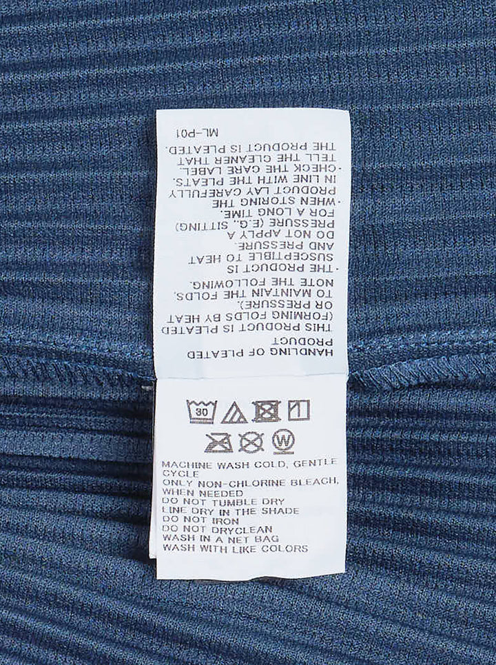 Homme Plissé Issey Miyake Monthly Colors September sleeveless pleated hoodie top in deep ocean blue with drawstring hood and snap-button closure - view 3