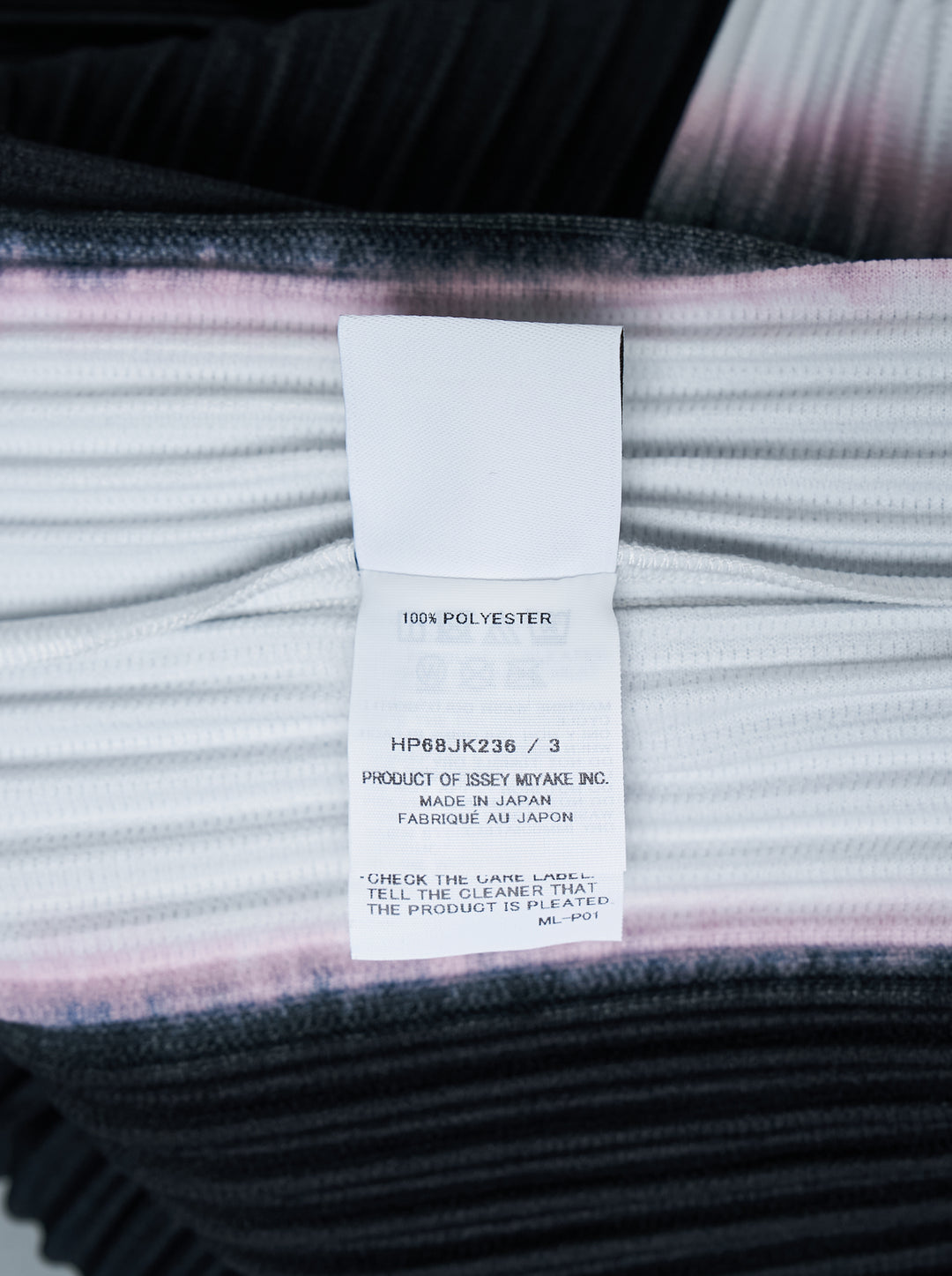 Back view of Homme Plissé Issey Miyake Framework : Chusen pleated short-sleeve top with high funnel neck and blurred black colour-block print edged in white and pink - view 3