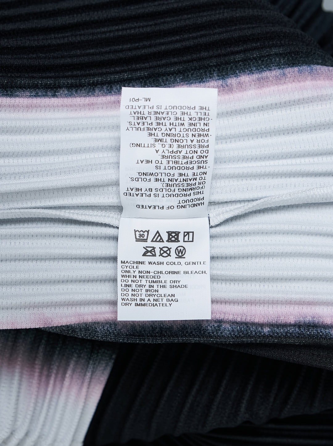 Back view of Homme Plissé Issey Miyake Framework : Chusen pleated short-sleeve top with high funnel neck and blurred black colour-block print edged in white and pink - view 4