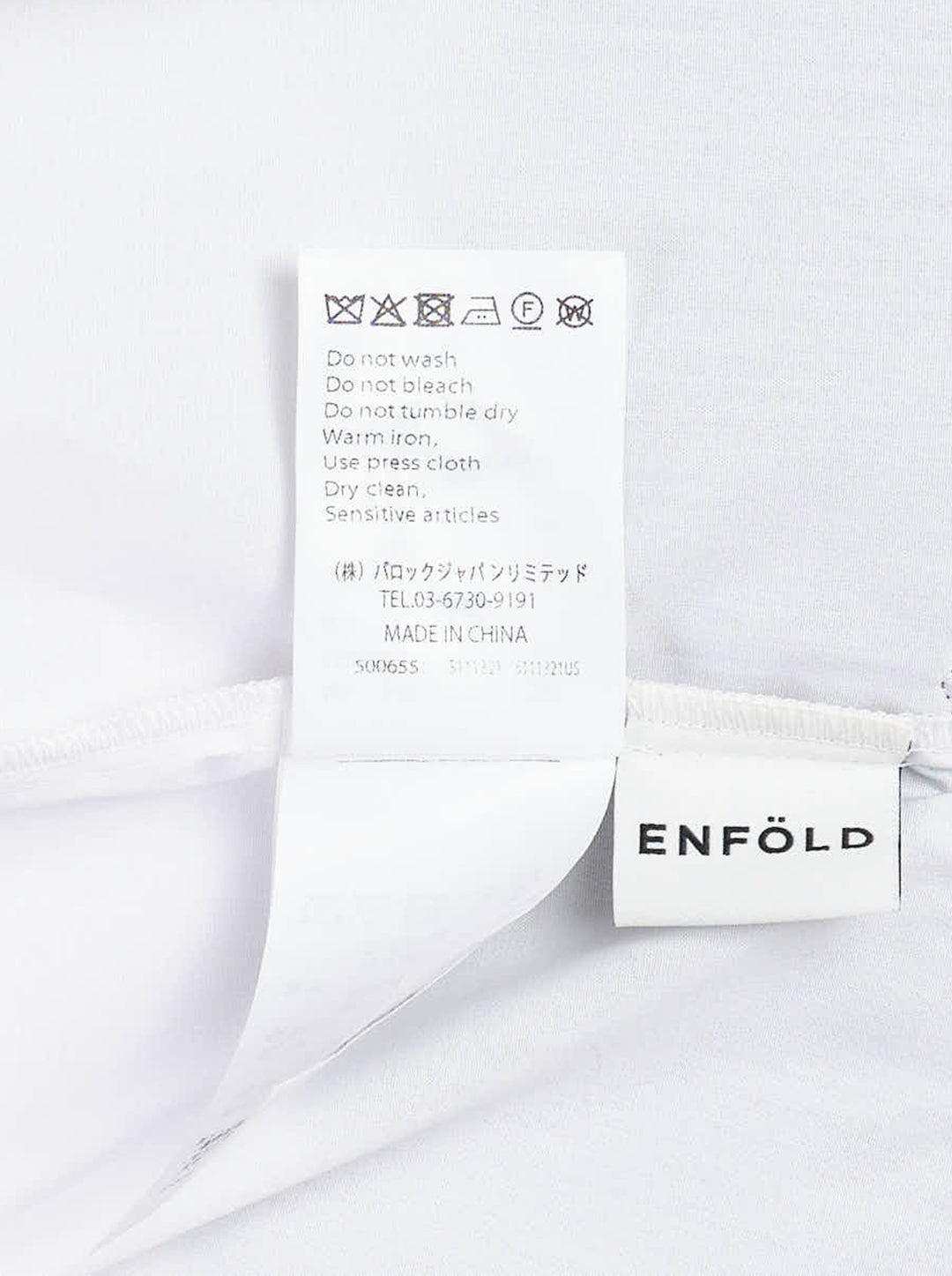 Enfold Knitted Docking Shirt — white cotton poplin long-sleeve shirt with integrated black ribbed knit bandeau panel featuring mother-of-pearl buttons and ruched sleeves, flat lay on white background - view 3