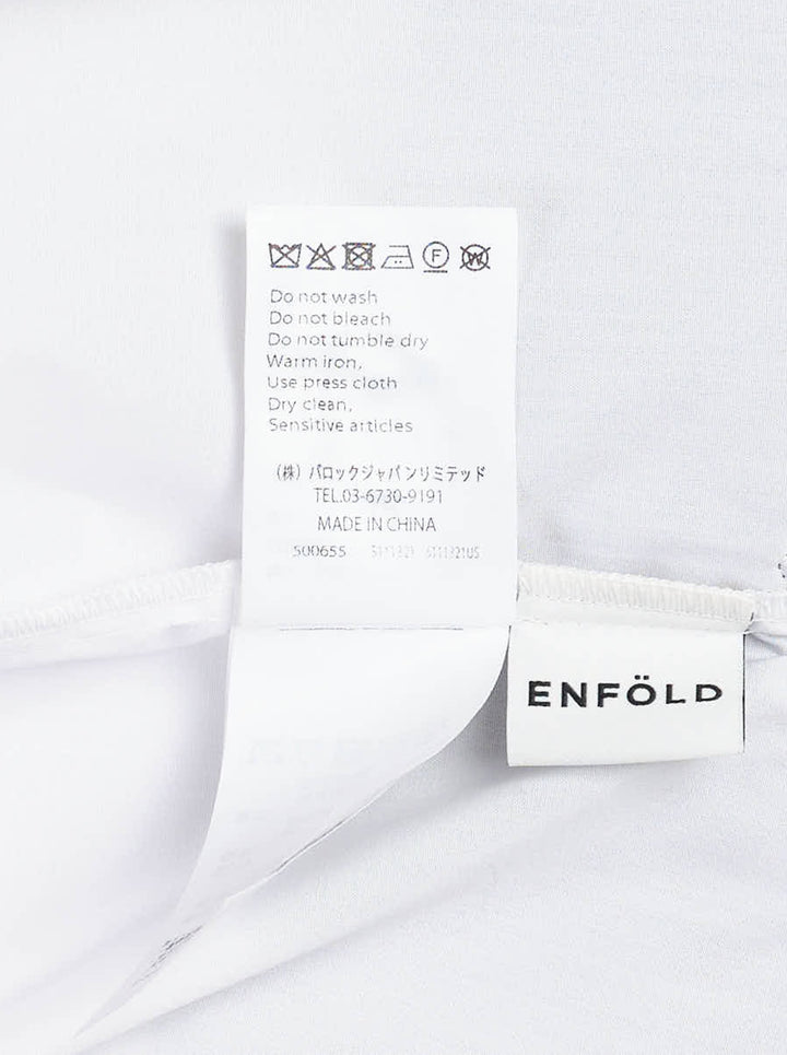 Enfold Knitted Docking Shirt — white cotton poplin long-sleeve shirt with integrated black ribbed knit bandeau panel featuring mother-of-pearl buttons and ruched sleeves, flat lay on white background - view 3