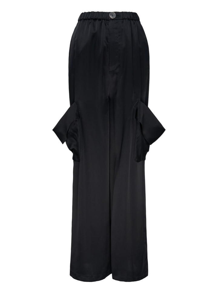 Enfold Draped Pocket Pants in black — wide-leg trousers with sculptural draped hip pockets and elasticated waistband, front view