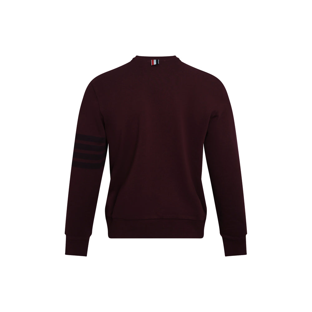 Thom Browne deep burgundy long sleeve crewneck sweatshirt with signature four-bar stripe on the sleeve and ribbed cuffs and hem - view 2