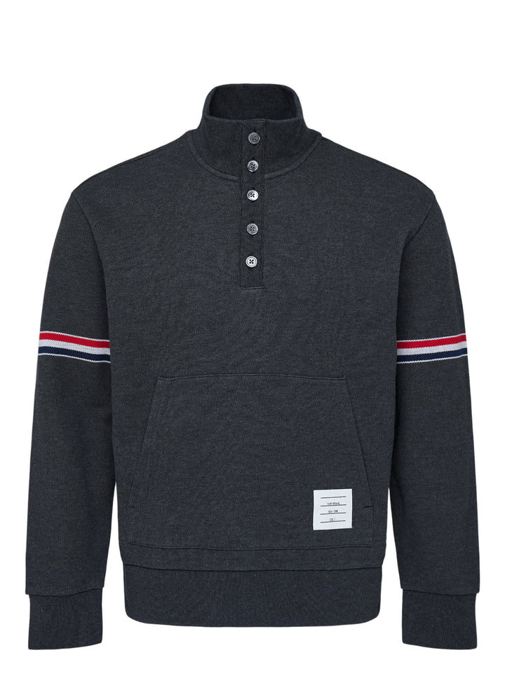 Thom Browne charcoal grey piqué funnel neck pullover with five-button placket, kangaroo pocket and red, white and blue striped sleeves