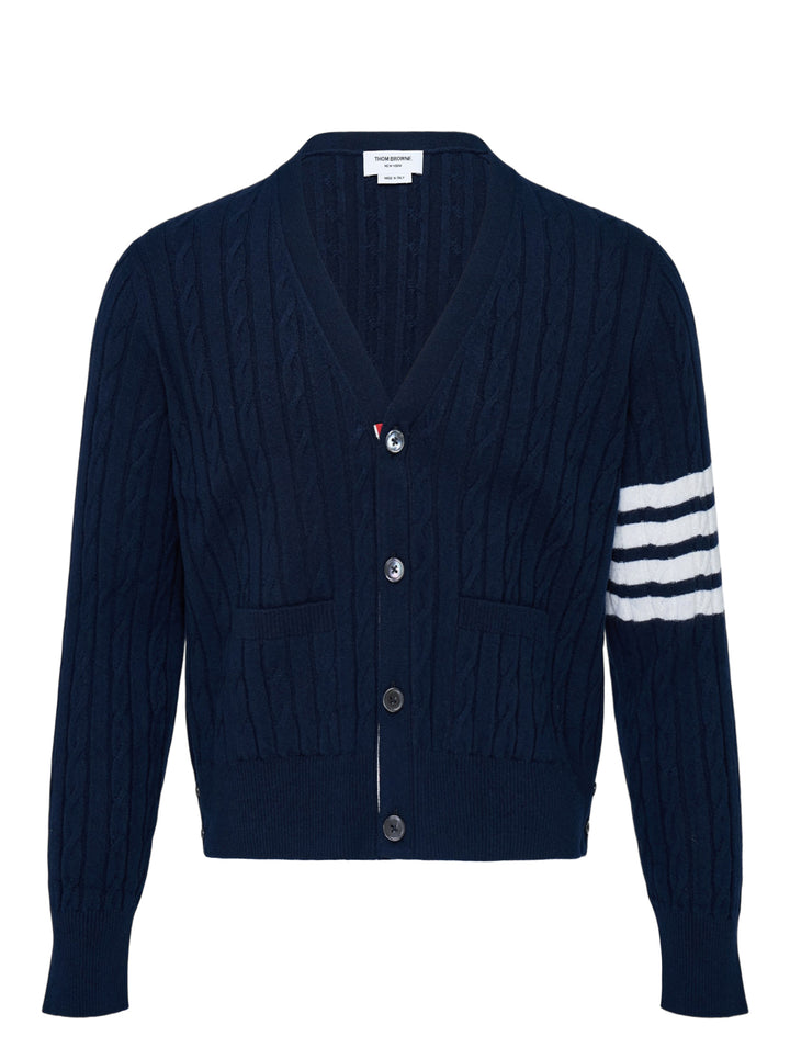 Navy cable-knit V-neck cardigan with white 4-bar stripe on the sleeve, button front and two front pockets
