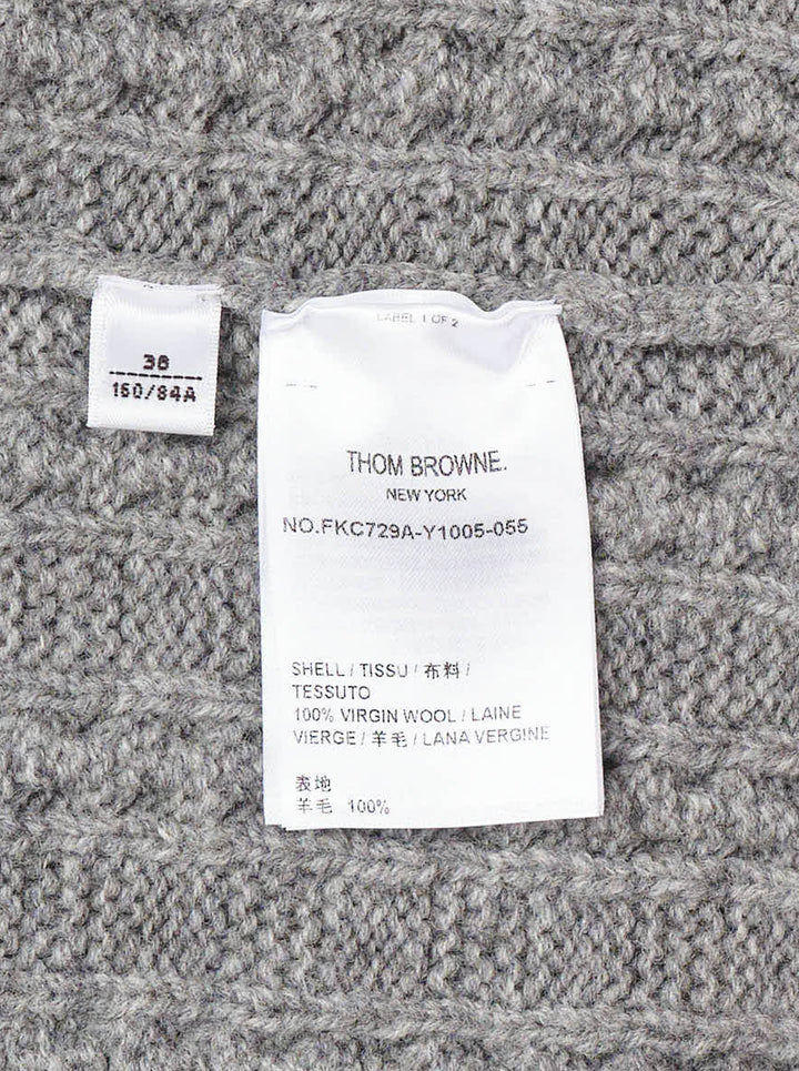 Thom Browne grey cable knit V-neck cardigan with cream 4-bar stripe on the sleeve and button front - view 3