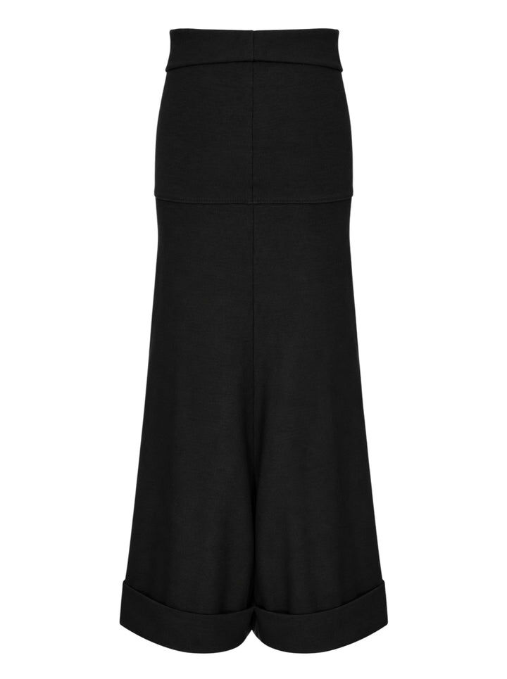 Junya Watanabe straight-leg minimal pants in black, featuring a fold-over waistband, wide silhouette, centre-front seam, and deep turned cuff at the hem, displayed flat on a white background - view 2