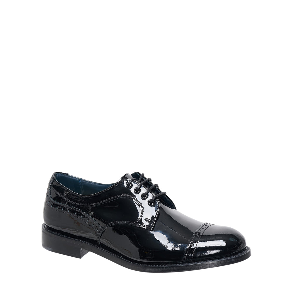 Junya Watanabe x Tricker's men's high-gloss patent leather cap-toe Oxford shoe with brogue perforated detailing and lace-up closure, side profile view