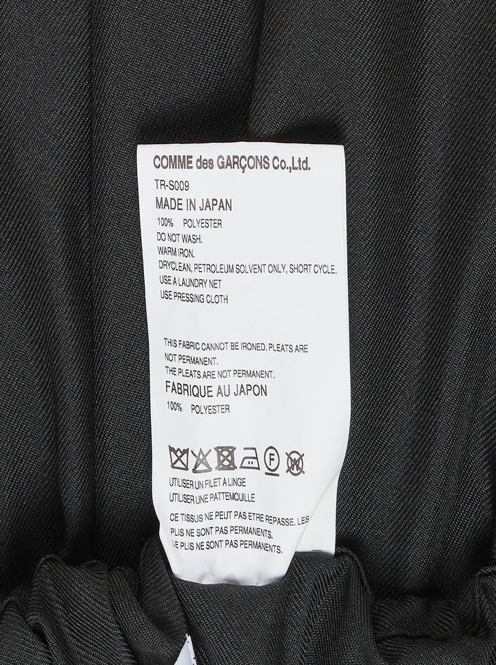 Tao black layered pleated midi skirt with elasticated waist, vertical pleats, gathered mid-section, and double-tiered ruffled hem, displayed on white background - view 3