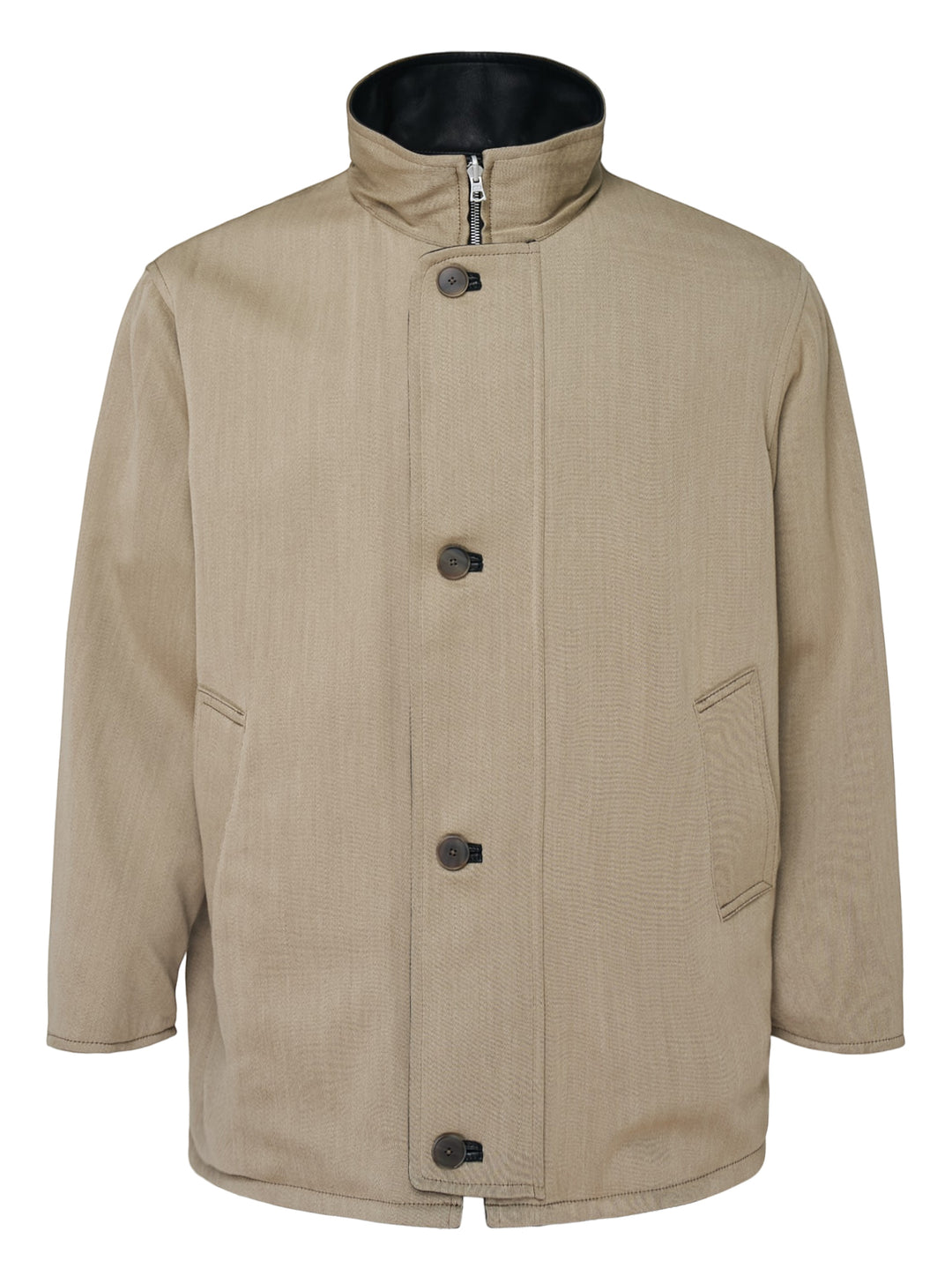 Auralee reversible wool twisted twill coat in beige with stand collar, button front and black leather reverse visible at the collar