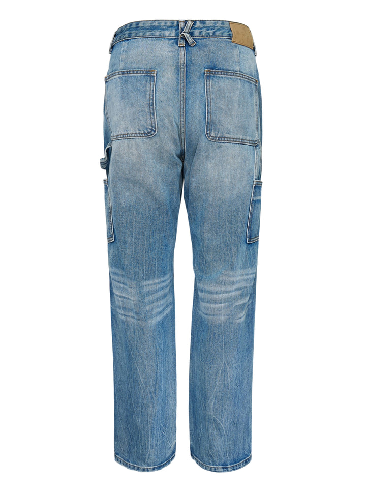 KidSuper Studios Eye Badge washed double knee jeans in faded blue denim with contrast topstitching and utility hammer loop, front view - view 2