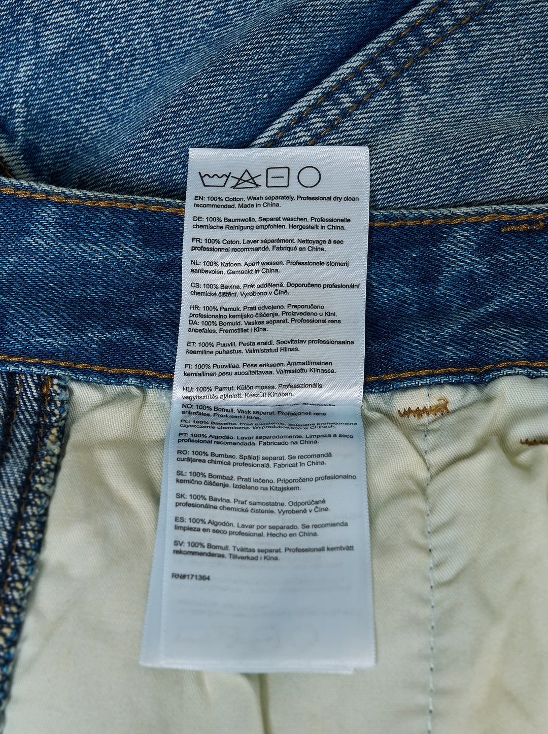 KidSuper Studios Eye Badge washed double knee jeans in faded blue denim with contrast topstitching and utility hammer loop, front view - view 5