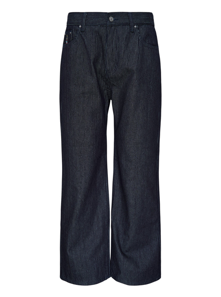 KidSuper Studios Stripe Dove Denim Pants in dark indigo with fine vertical pinstripes, a ridged waistband and a wide-leg cut, shown from the front