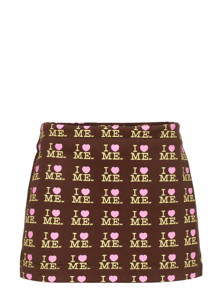 Ashley Williams Choco I Heart Me Mini Skirt in chocolate brown with all-over 'I ♥ ME' logo repeat print in yellow and pink, featuring a fitted A-line silhouette and structured waistband